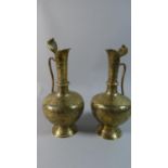 A Pair of Indian Brass Jugs with Etched Decoration Depicting Hindu Gods and Cobra Handles, 26cm high