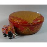 An Oriental Lacquered Cane Work Circular Lidded Box Together with a Decorated Wooden Indian