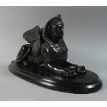 A Continental Museum Replica Study of Winged Sphinx on Oval Wooden Plinth, 30cm Long