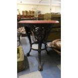 A Circular Topped Cast Iron Based Pub Table with Maiden Mask Mounts, 58cm Diameter