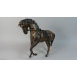 A Mid 20th Century Leather Covered Study of a Spanish Horse, 32cm High