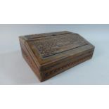 An Indian Carved Wooden Writing Slope with Stationery Box Back Having Hinged Lid and Fold Front,