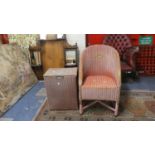 A Lloyd Loom Armchair and Linen Box