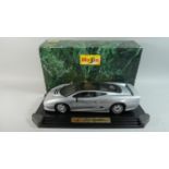 A Boxed Maisto Model of a Jaguar XJ220 (1992) on Plinth, 47cm Wide