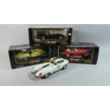 A Collection of Three Boxed Burago E Type Jaguar Models Together with One Boxed Example