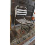 A Set of Three Vintage Metal Framed Stacking Chairs