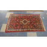 A Patterned Handmade Woollen Rug, 132cm Wide