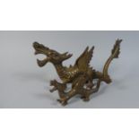 A Pair of Bronzed Winged Dragon Ornaments, 23cm x 14cm Long