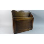 An Edwardian Oak Wall Hanging Sectioned Shelf Unit with Pull Down Front, 38cm Wide