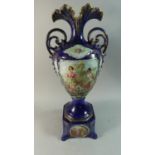 A Continental Cobalt Blue Two Handled Vase with Cartouche Depicting Cherubs and Maidens on Square