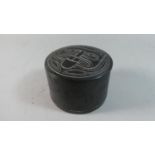 A South American Circular Carved Stone Effect Tobacco Box with Incised Decoration