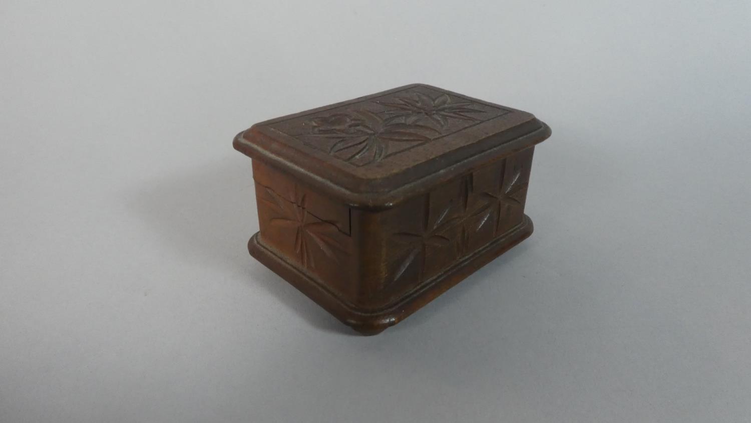 A Small Black Forest Carved Wooden Rectangular Puzzle Box, 8.5cm Wide