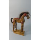 A Vintage Carved Wooden Toy Horse with Articulated Legs Set on Stand, 29cm High