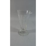 An Etched Measuring Glass Flask, 15cm high