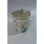 A Hand Enamelled Opaque Glass Hexagonal Biscuit Barrel Decorated with Wild Flowers and