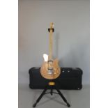 An Ernie Ball Music Man Axis Super Sport Guitar with Figured Maple Top, Natural, and Complete with