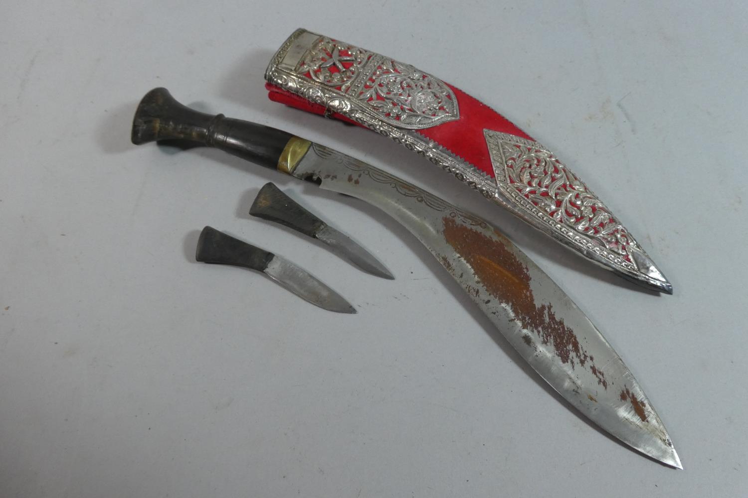 A Souvenir Kukri Knife with Daggers, in Silver Plate Mounted Scabbard