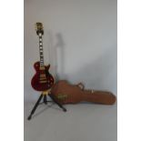 A 1978 Gibson Les Paul Custom Guitar in Wine Red. Wear Commensurate with Age and Gigging. Seems to