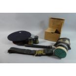 A WWII Gas Mask, Pair of Binoculars, Leather Belt and Gun Sight