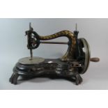 An Early Sewing Machine with Gilt Decoration by Jones & Co. Manchester, 40cm Long