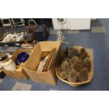 A Box Containing Various Prints and a Wicker Basket Containing Pine Cones