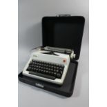 A Vintage Cased Olympia Manual Typewriter