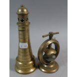 A Circular Bronze Screw Action Nutcracker and a Novelty Money Box in the Form of a Lighthouse, 17.