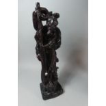 A Modern Oriental Resin Study in the Form of a Carved Fisherman with Rod and Fish, 43cm High