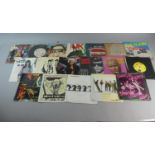 A Collection of Eighteen 45rpm Singles to Include Billy Idol, The Clash, The Smiths, UK Subs, The