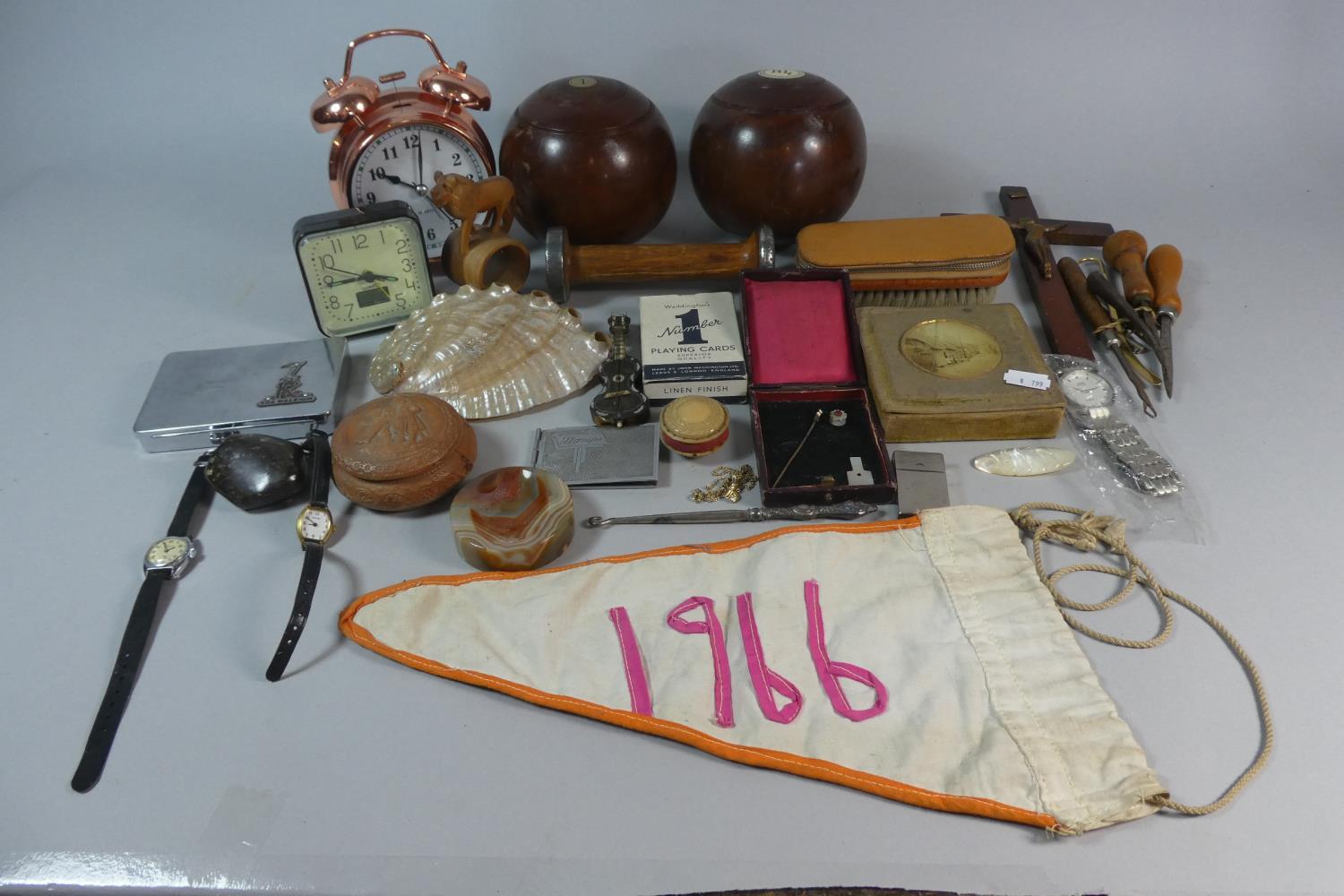 A Tray of Curios to Include Lawn Bowls, Copper Alarm Clock, Crucifix, Mother of Pearl Shell,