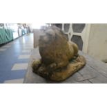 A Cast Terracotta Garden Figure of a Reclining Lion, 40cm Long