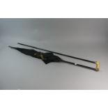 A Late 19th Century Ebonised and Ivory Handled Ladies Walking Cane with Gold Plated Mount Together