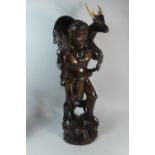 A Late 20th Century Carved Souvenir Figure of Hunter Carrying Stag, 70cm High
