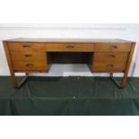 A 1970 Uniflex Kneehole Desk or Dressing Table with King Centre Drawers Flanked by Three Shorter