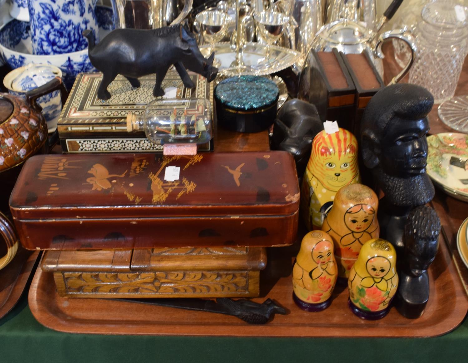 A Tray Containing Oriental Lacquered and Inlaid Boxes, African Carved Ornaments, Russian Dolls,