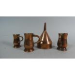 A Collection of Three Copper Measures and a Wine Funnel, 13cm High