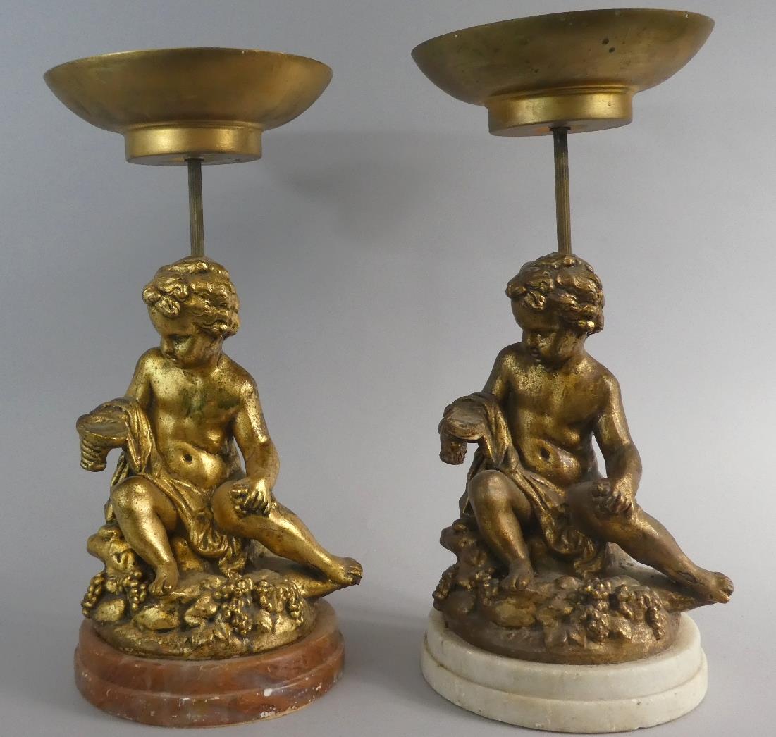 A Pair of Gilt Figural Pot Plant Stands in the Form of Seated Cherubs, 43cm High