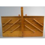 A Cantilevered Three Layered Sewing Box with Bentwood Carrying Handle and Contents, 43cm Wide When