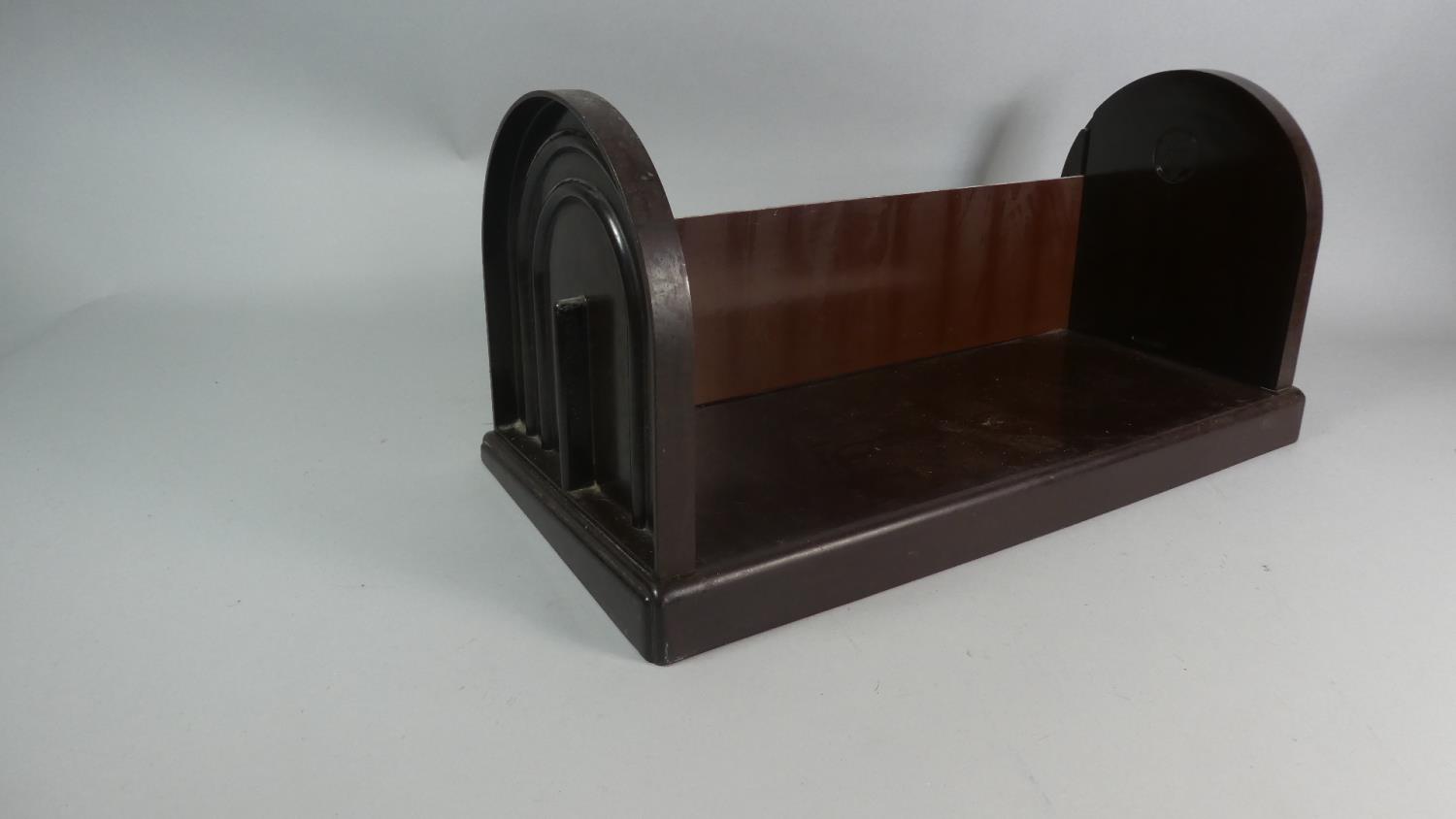 An Art Deco Bakelite Book Trough, "The Ebco Patent Bookcase", 48cm Long