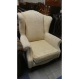 A Modern Upholstered Wing Armchair