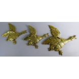 A Set of Three Graduated Wall Hanging Brass Flying Ducks, The Largest 29cm Long