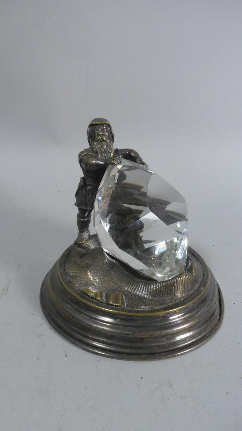 A Novelty Desktop Paperweight in the Form of Dwarf Holding Giant Glass Diamond, Silver Plated