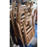 A Collection of Four Folding Wooden Garden Chairs