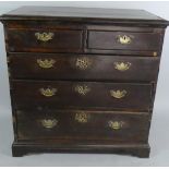 An 18th Century George II Oak Chest of Drawers with Cross Banded Top Over Five Drawers Supported