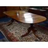A 19th Century Mahogany Oval Top Dining Table on Reeded Tripod D Ends with Brass Claw Casters. Two
