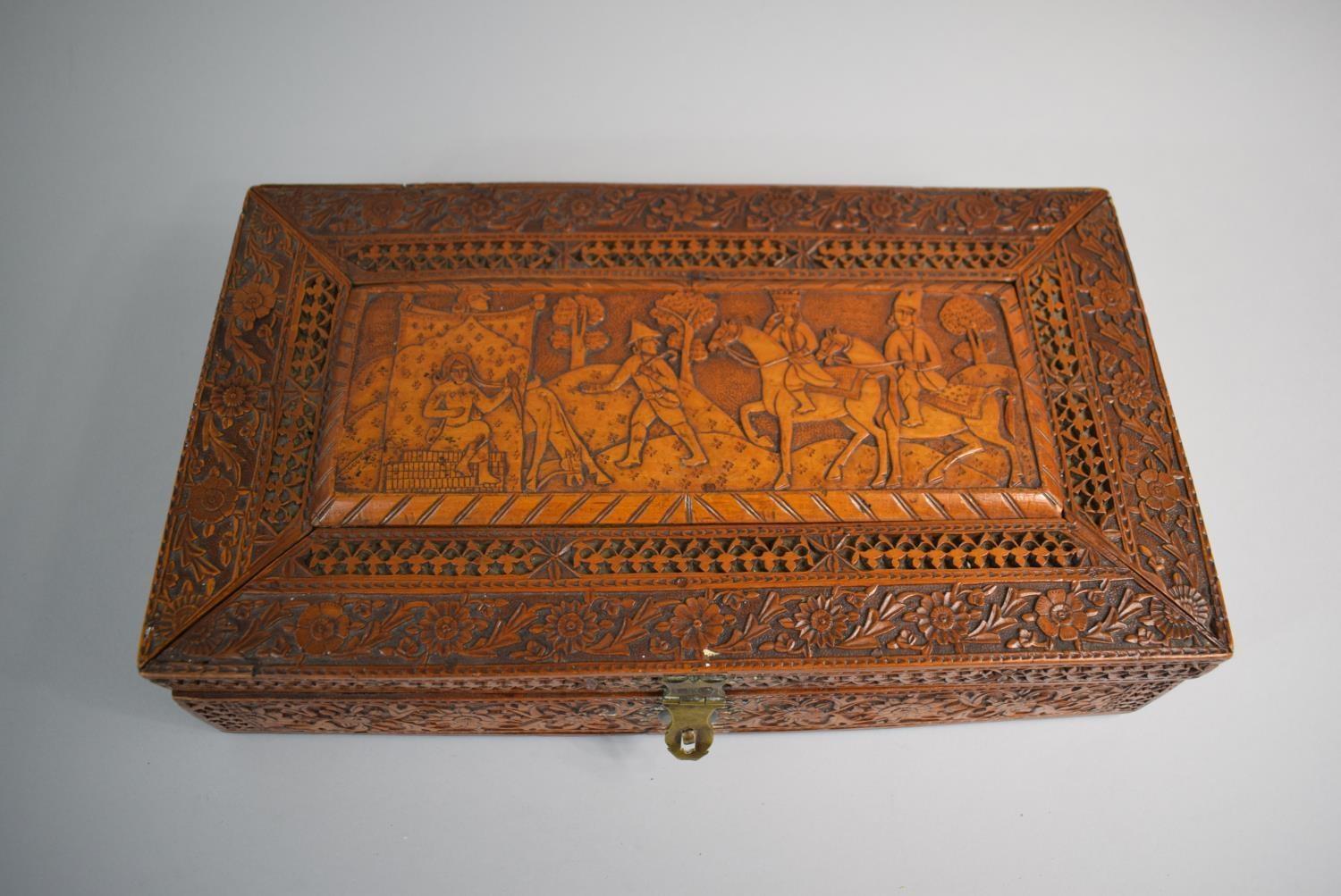 An Intricately Carved Wooden Box, Possibly Spanish South American Colonial, The Hinged Lid Depicting