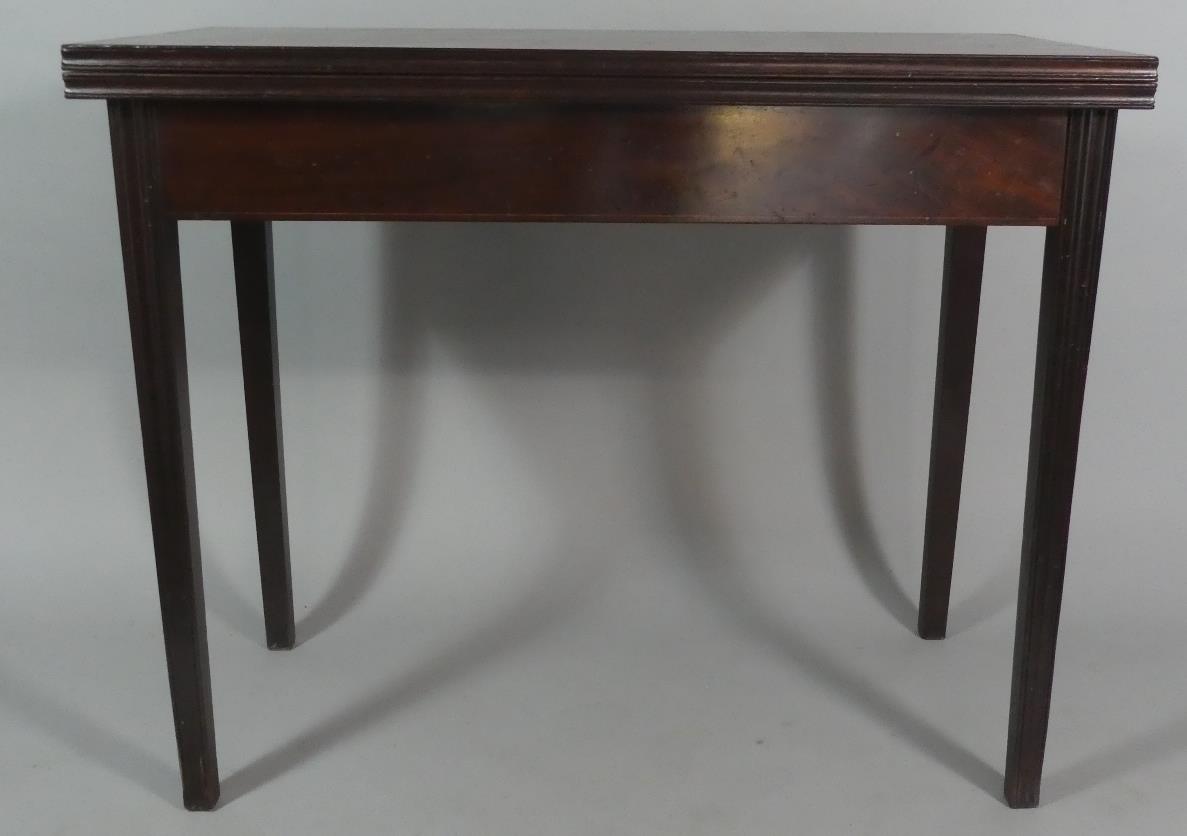 A 19th Century Lift Top Tea Table on Tapering Reeded Supports. 92cm Wide