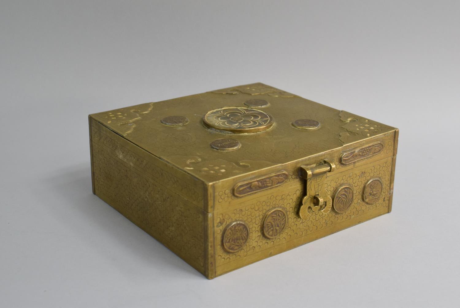 A Mid 20th Century Chinese Brass Two Section Box with Lid. Token Mounts to Front and Lid. 15.5cms