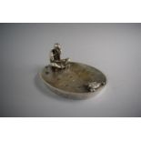 An American Silver Plated Oval Dish Decorated with Cross Legged Seated Indian Holding Pipe Staring