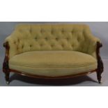 A Late Victorian Mahogany Framed Button Upholstered Salon Settee with Scrolled and Carved